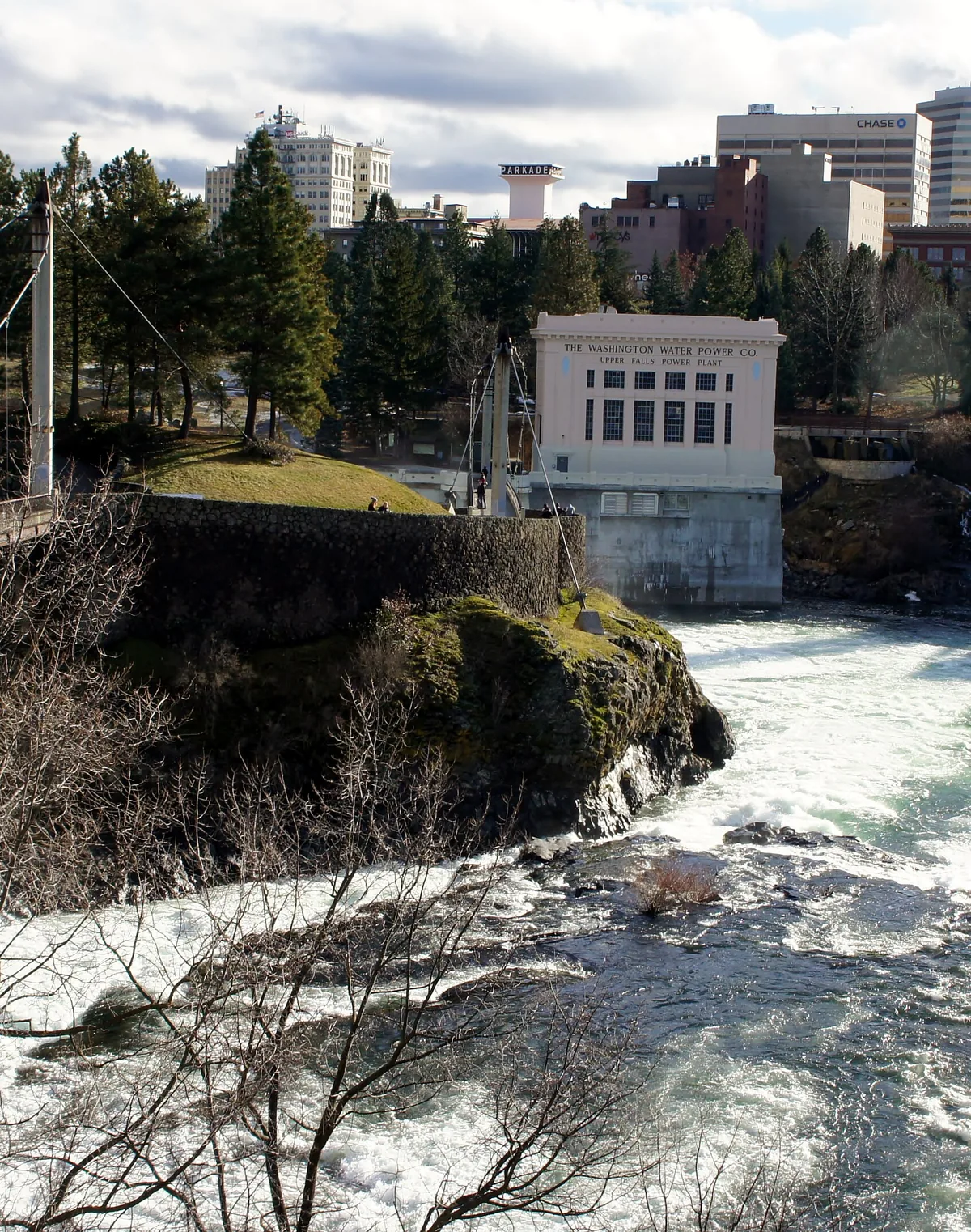 The Spokane Falls and downtown Spokane, Washington skyline behind the historic power plant